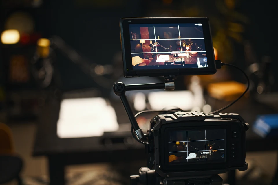Camera monitors showing a scene on a film set.