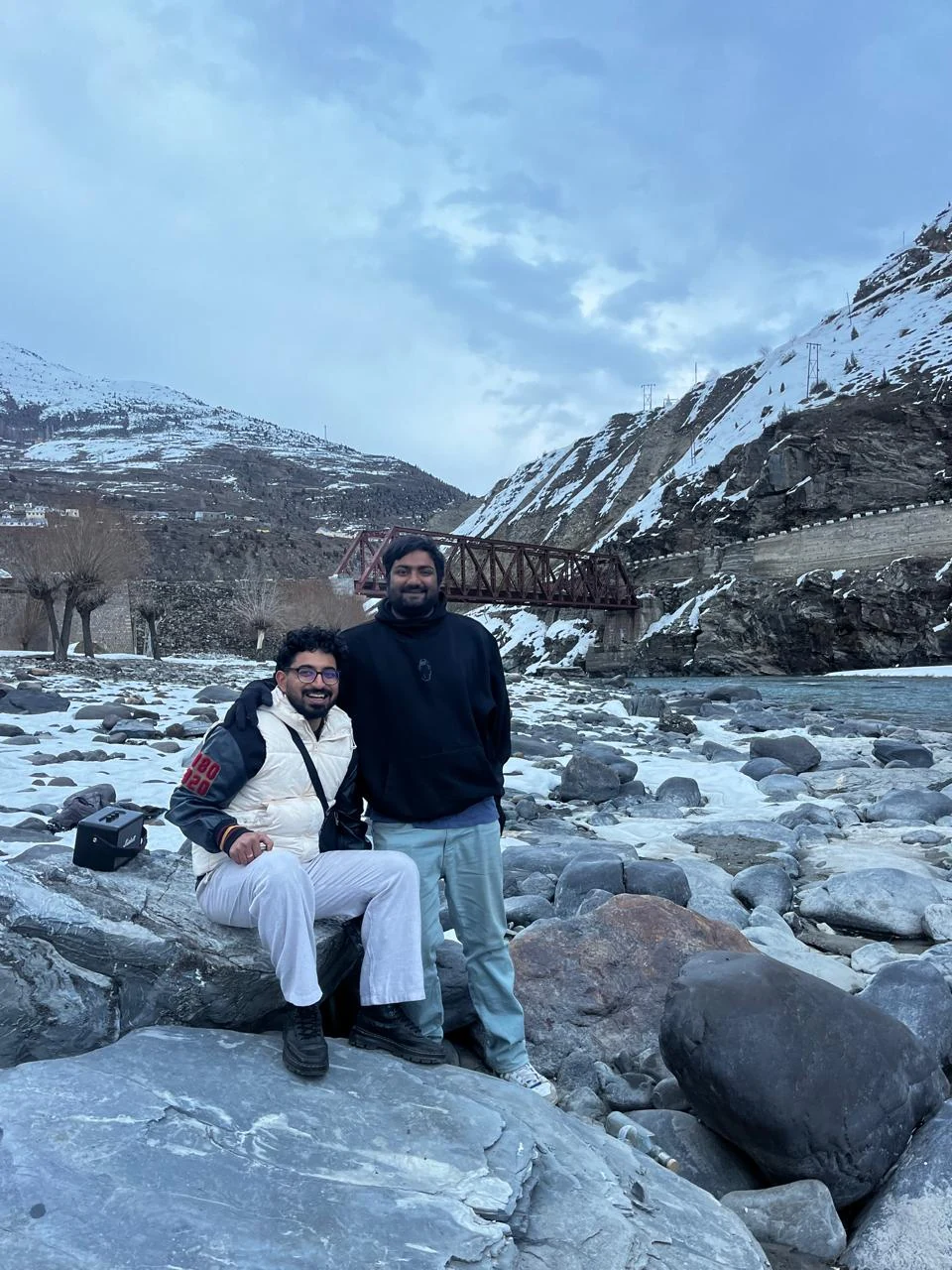 The KADIMA founders together beside a river in the snowy mountains.
